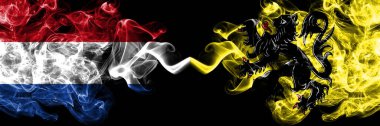 Hollanda, Flanders 'a karşı Flaman dumanlı mistik bayraklar yan yana yerleştirildi. Kalın renkli ipeksi soyut duman bayrakları.