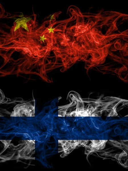 China, Chinese vs Finland, Finnish smoky mystic flags placed side by side. Thick colored silky abstract smoke flags.