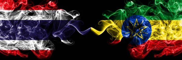 Thailand, Thai vs Ethiopia, Ethiopian smoky mystic flags placed side by side. Thick colored silky abstract smokes flags.