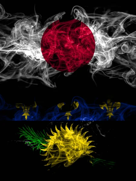 日本和法国 瓜德罗普岛的烟熏国旗 — 图库照片