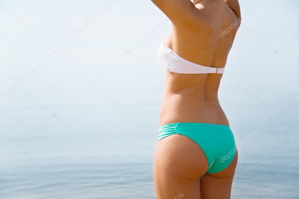 Young woman removes panties Stock Photo