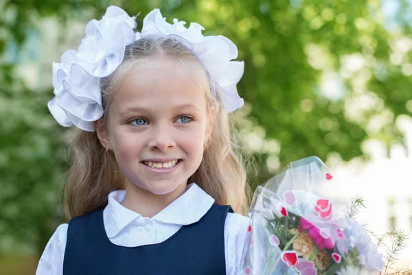 First grader girl with bows — Stock Photo, Image