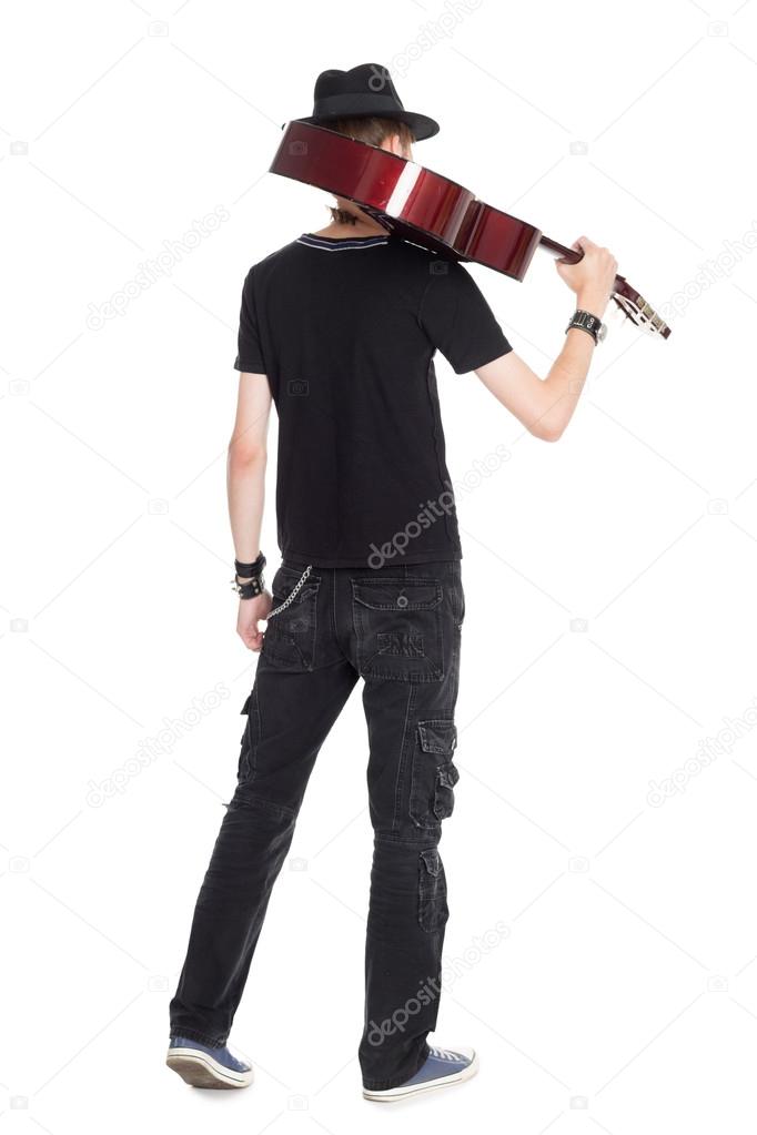 Male guitarist with guitar rear view
