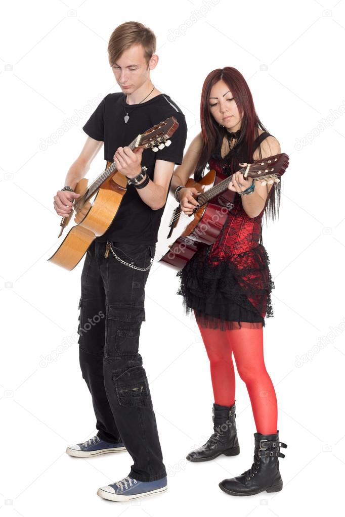 Young musicians play guitars