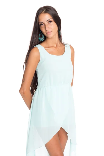 Charming brunette in a turquoise dress — Stock Photo, Image