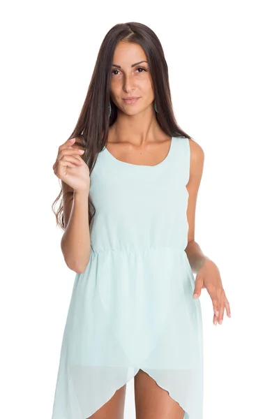 Mooie brunette in een turquoise jurk — Stockfoto