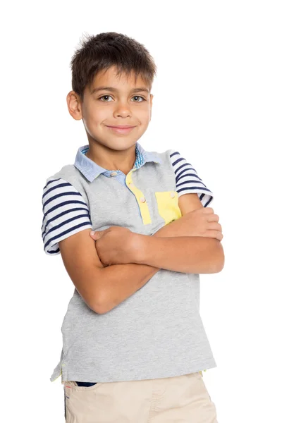 Sorrindo menino com os braços cruzados — Fotografia de Stock