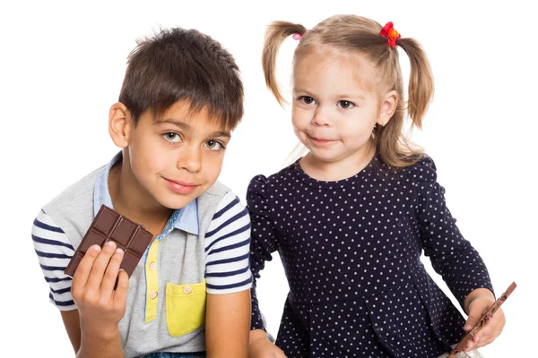 Brother and sister with chocolate — Stock Photo, Image