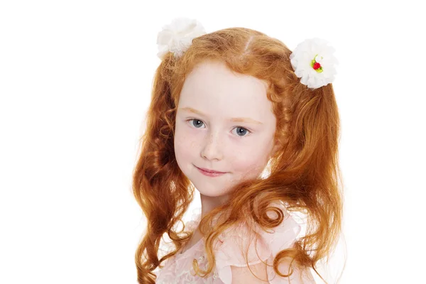 Little red haired girl with a bows — Stock Photo, Image