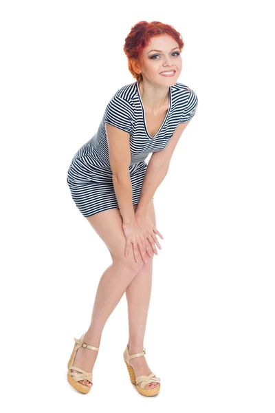 Beautiful young woman in a striped dress — Stock Photo, Image