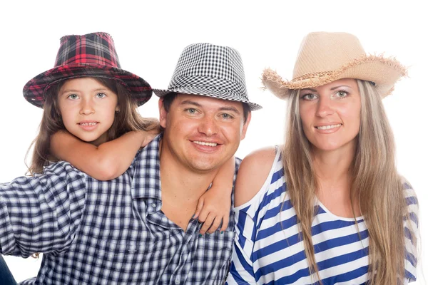 Счастливая семья в шляпах — стоковое фото