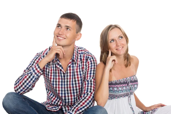 Smiling young girl and guy looking up — Stock Photo, Image