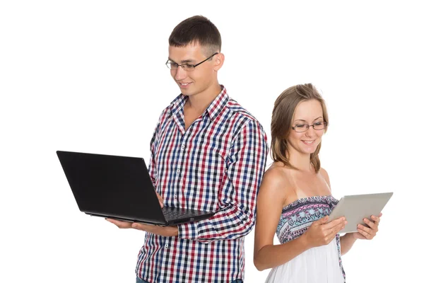 Mulher e homem com um laptop e tablet PC — Fotografia de Stock