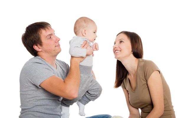 Felice madre e padre giocare con suo figlio — Foto Stock