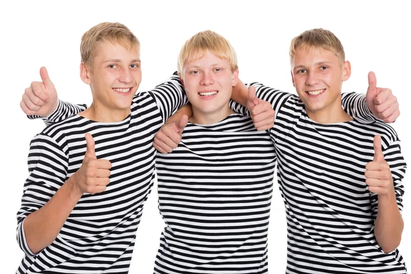 Lachende jongens met verhoogde duimen — Stockfoto
