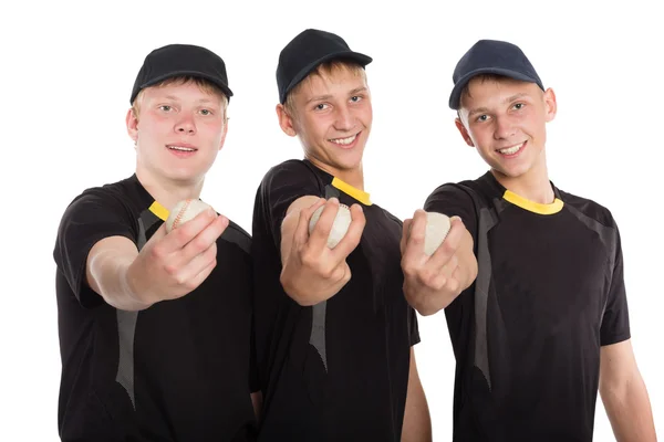 Бейсболисты держат мячи в руках — стоковое фото