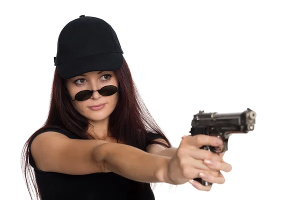 Young woman shoots a gun — Stock Photo, Image