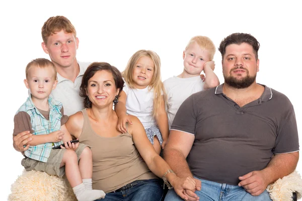 Happy big family sitting on sofa — Stock Photo, Image