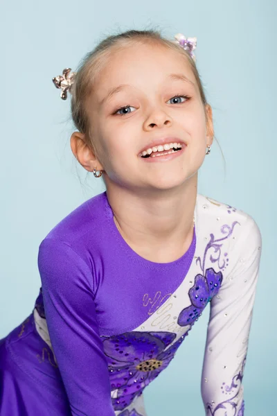 Happy girl seven years on a blue background — Stock Photo, Image