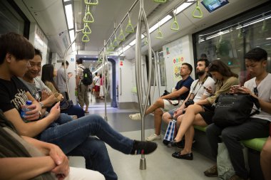 Passengers traveling on the subway in Singapore