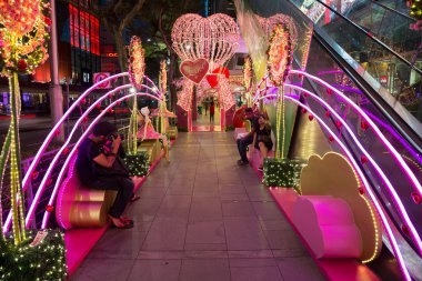 People walk the Orchard Road in Singapore