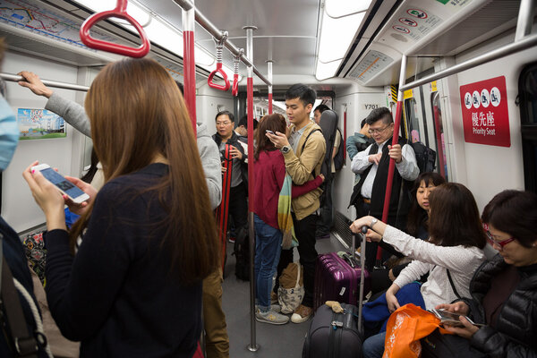 People traveling in the subway in Hong Kong