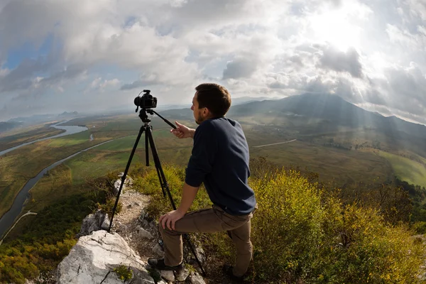 Photographer on top of the mountain — Stock Photo, Image