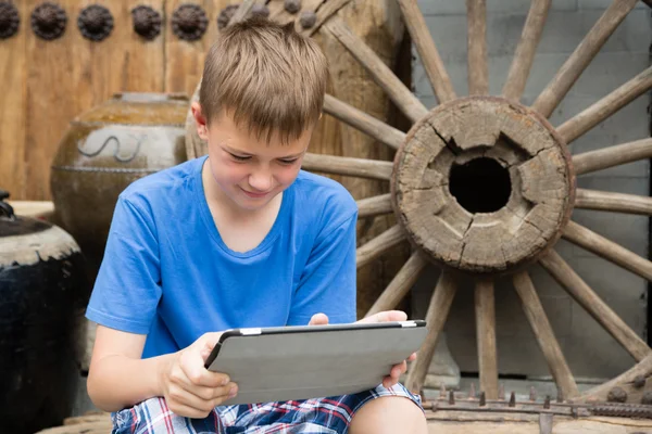 European boy used tablet PC — Zdjęcie stockowe