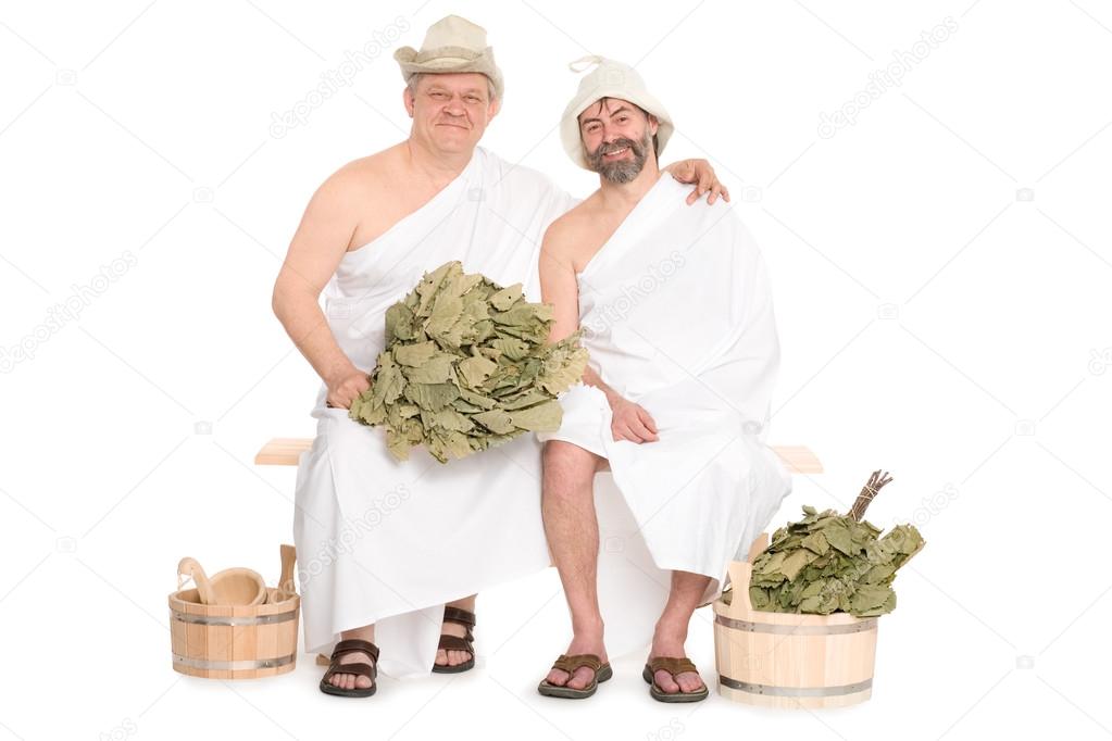 Two middle-aged men in traditional Russian sauna 