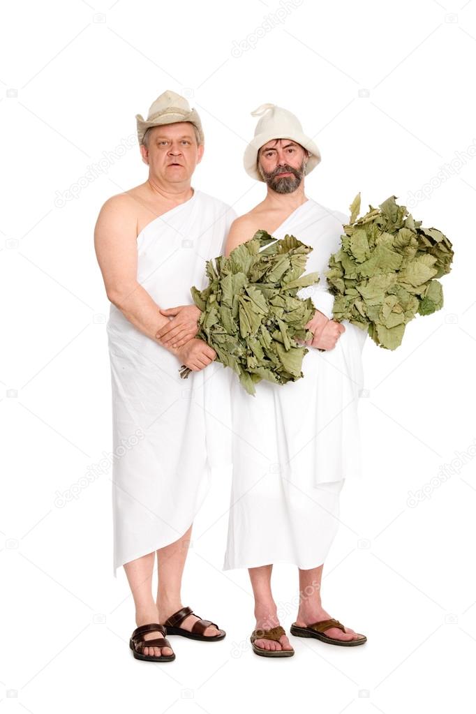 Joyful men with oak twigs in bathing costumes