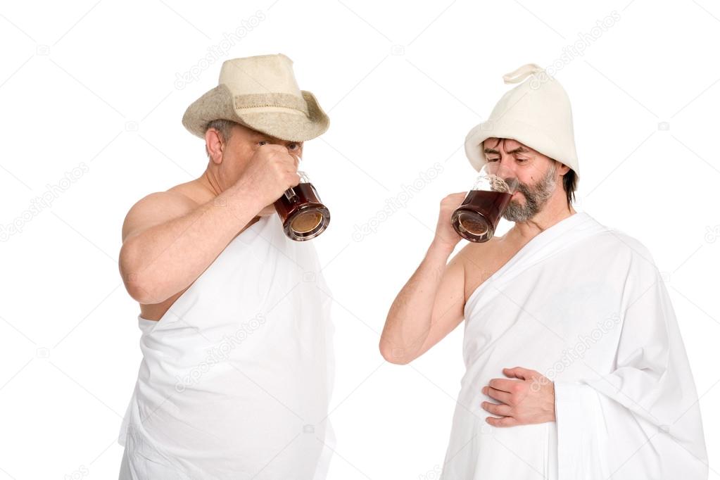 Joyful men drink kvas - russian bread juice