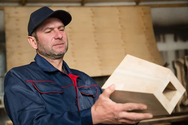 Inspector carpenter inspecting wood furniture part — Stock Photo, Image