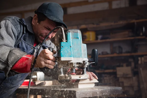 Carpenter milling machine processes the wood element — Stock Photo, Image