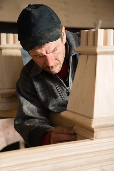 Carpenter checks to make furniture — Stock Photo, Image