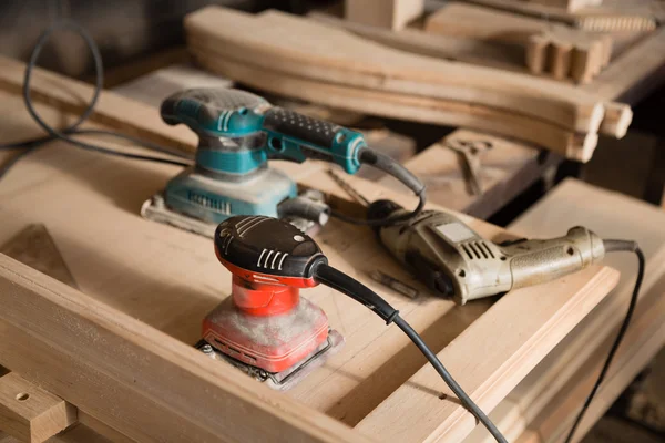 Carpentry tools - hand drill and a sander — Stock Photo, Image