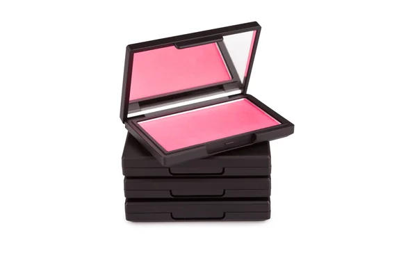 Rubor rosa en una pila de cajas de rubor aislados en blanco — Foto de Stock
