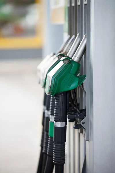 Pump nozzles at the gas station — Stock Photo, Image