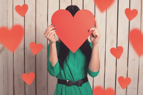 Woman with red heart — Stock Photo, Image