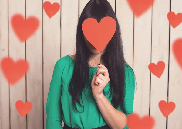 Woman with red heart — Stock Photo, Image