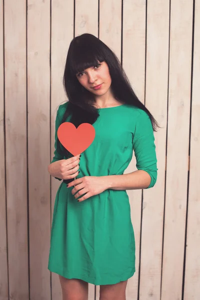 Woman with red heart — Stock Photo, Image