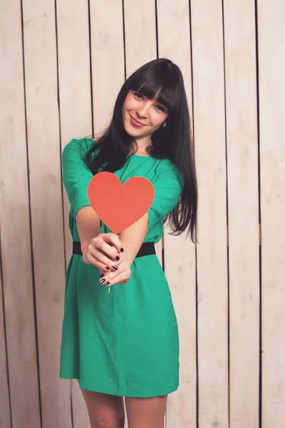 Woman with red heart — Stock Photo, Image