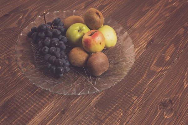 Different fruits are in dish — Stock Photo, Image