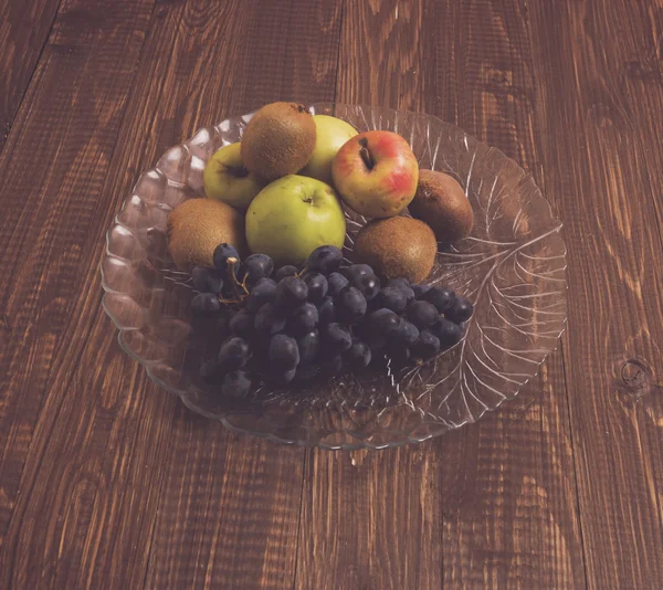 On a table different fruits in dish — Stock Photo, Image