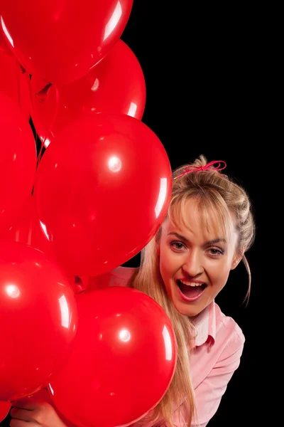 Pretty woman in blouse with red balloons — Stock Photo, Image