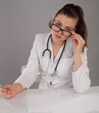 Nurse with glasses and pen clipart