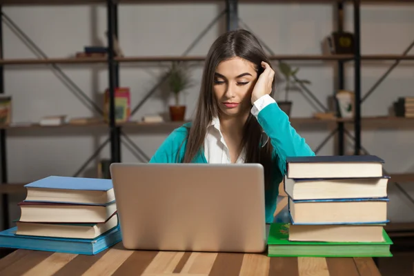 Tired woman with books — Stock Photo, Image