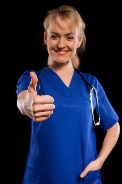 Doctor showing thumb up sign — Stock Photo, Image