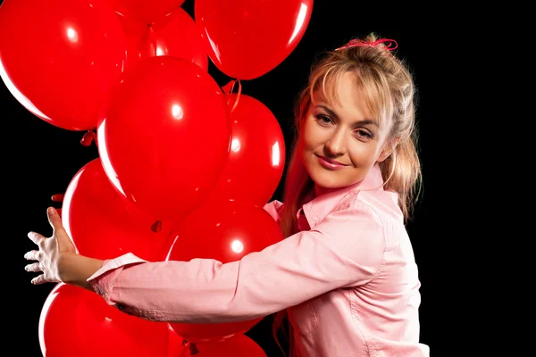 Ładna kobieta w bluzki z czerwone balony — Zdjęcie stockowe