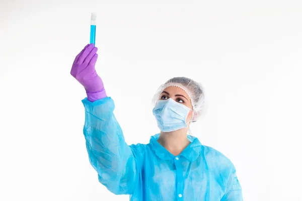 The woman showes blue tube — Stock Photo, Image