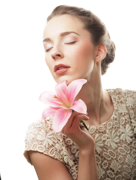 Girl holding lily flower in her hands — Stock Photo, Image